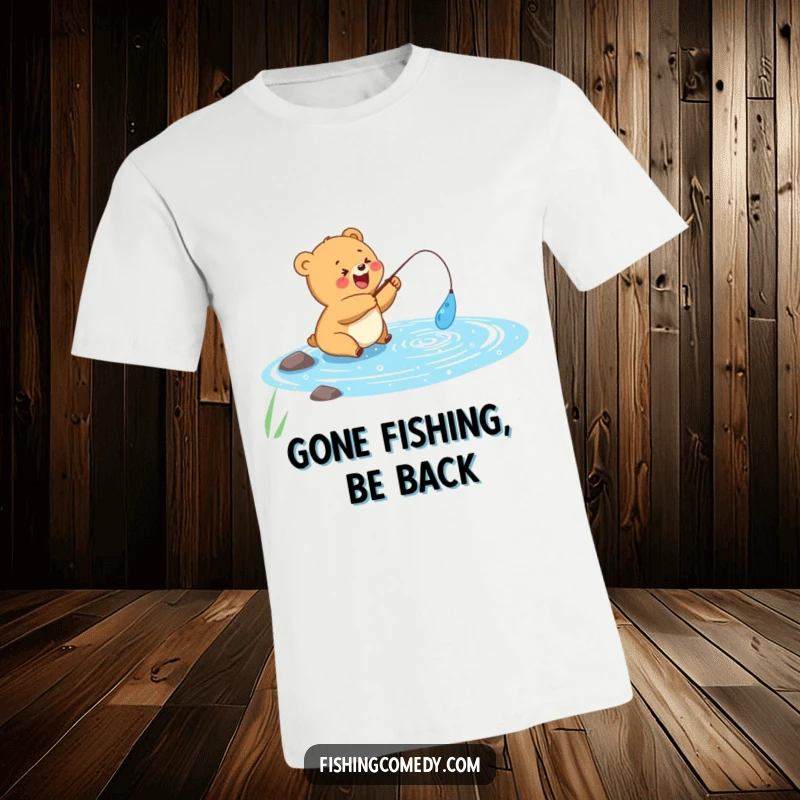 Funny t-shirt with a cheerful bear cub happily fishing in a sparkly blue lake, great funny gift for anglers.